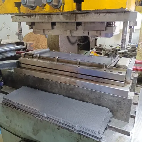 A stamping machine precisely forming a custom speaker grille design